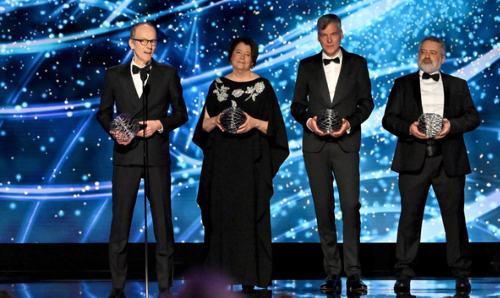 Andreas Hoecker, Patricia McBride, Marco van Leeuwen, and Vincenzo Vagnoni accept onstage during the Breakthrough Prize in Fundamental Physics the 11th Breakthrough Prize Ceremony at Barker Hangar on 